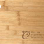 Health Volunteers International - Bamboo Cheese Board engraved with HVI logo