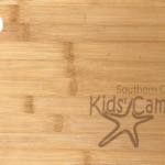 Southern Cross Kids' Camps - Bamboo Cheese Board engraved with SCKC logo